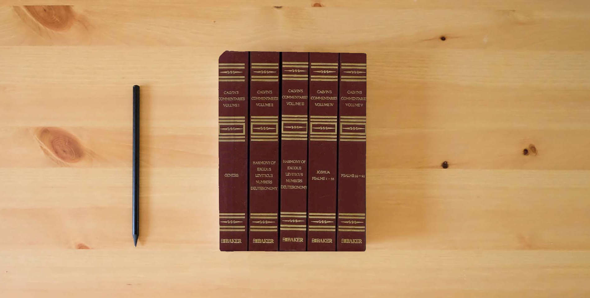 The book Calvins Commentaries (22 Volume Set) is on the table