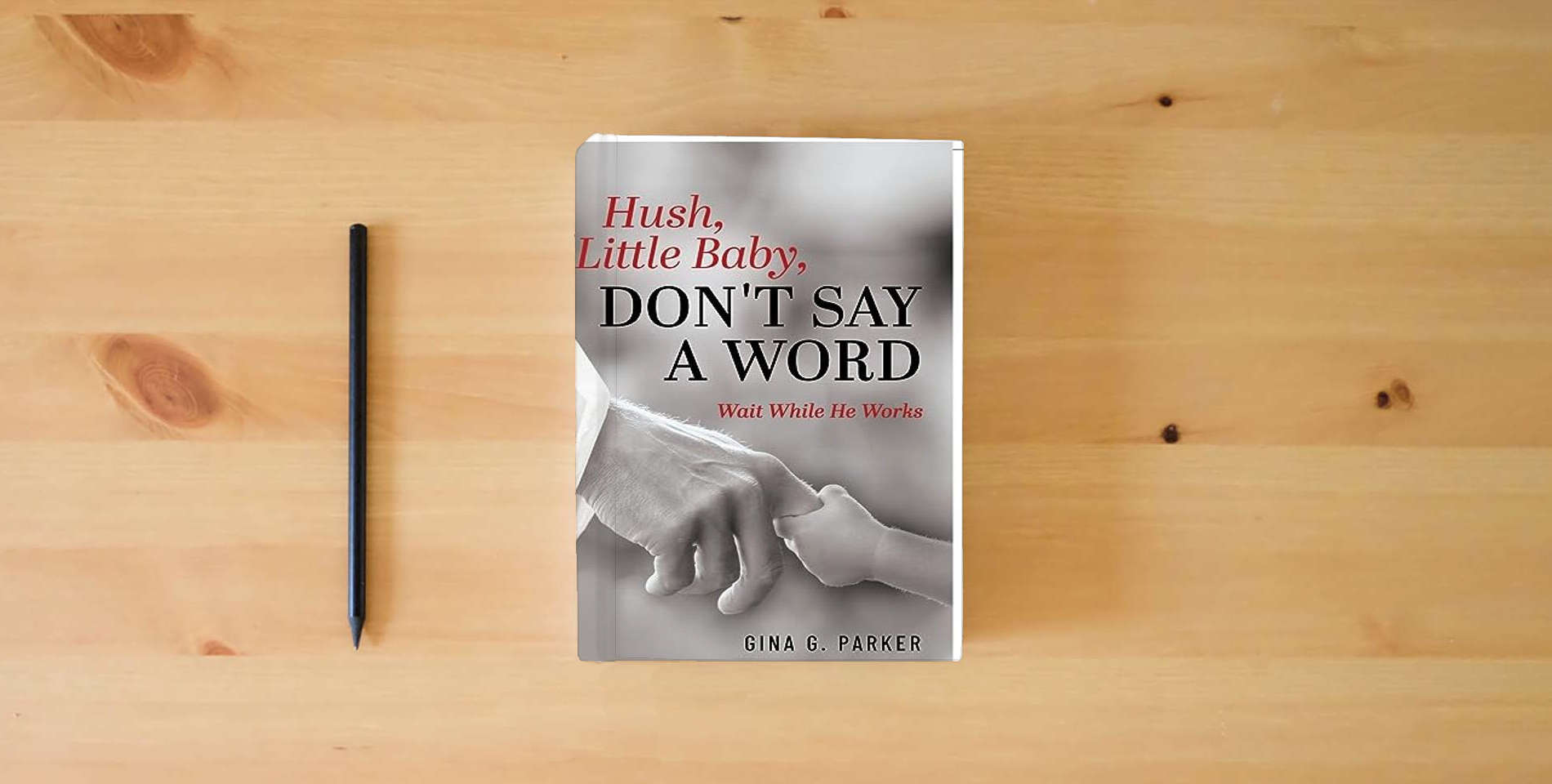 The book Hush, Little Baby, Don't Say a Word: Wait While He Works is on the table