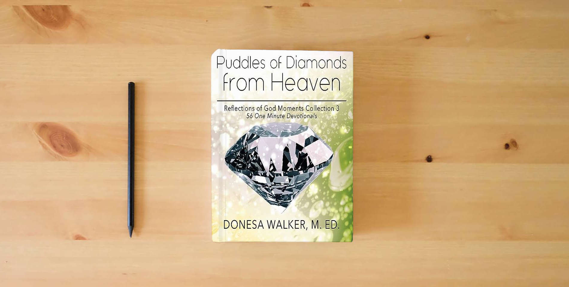 The book Puddles of Diamonds in Heaven is on the table