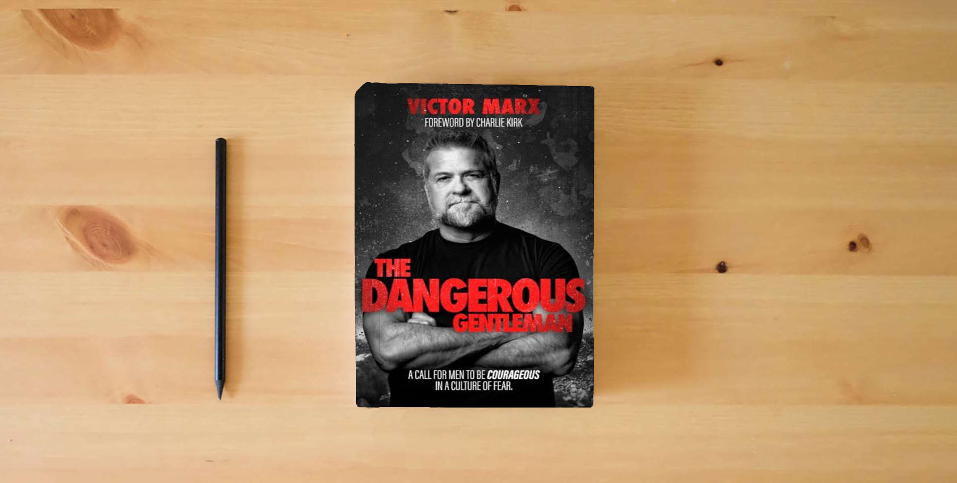 The book The Dangerous Gentleman: A Call For Men to be Courageous in a Culture of Fear is on the table