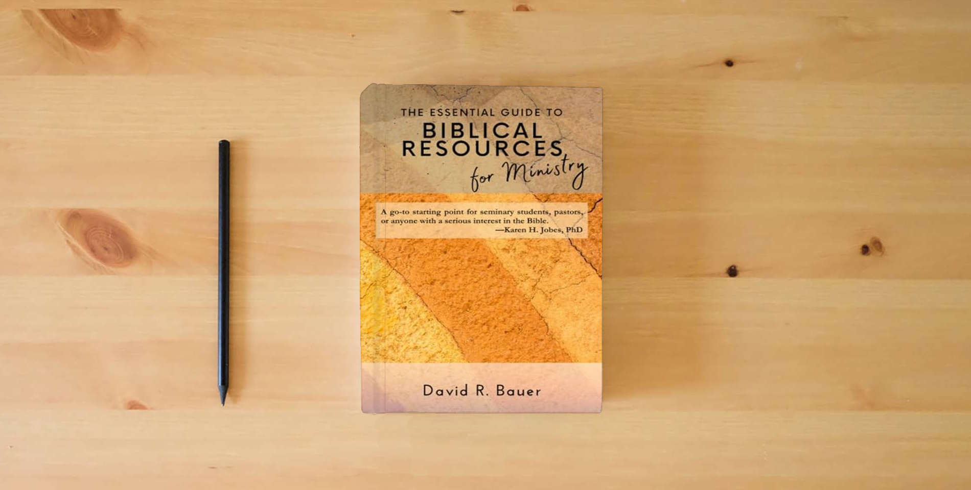 The book The Essential Guide to Biblical Resources for Ministry is on the table