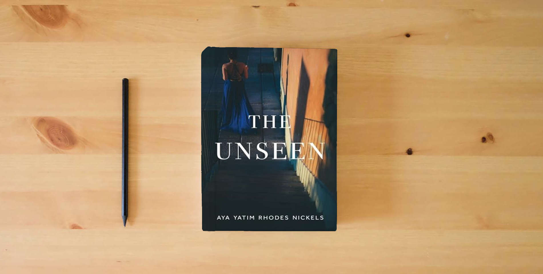 The book The Unseen is on the table
