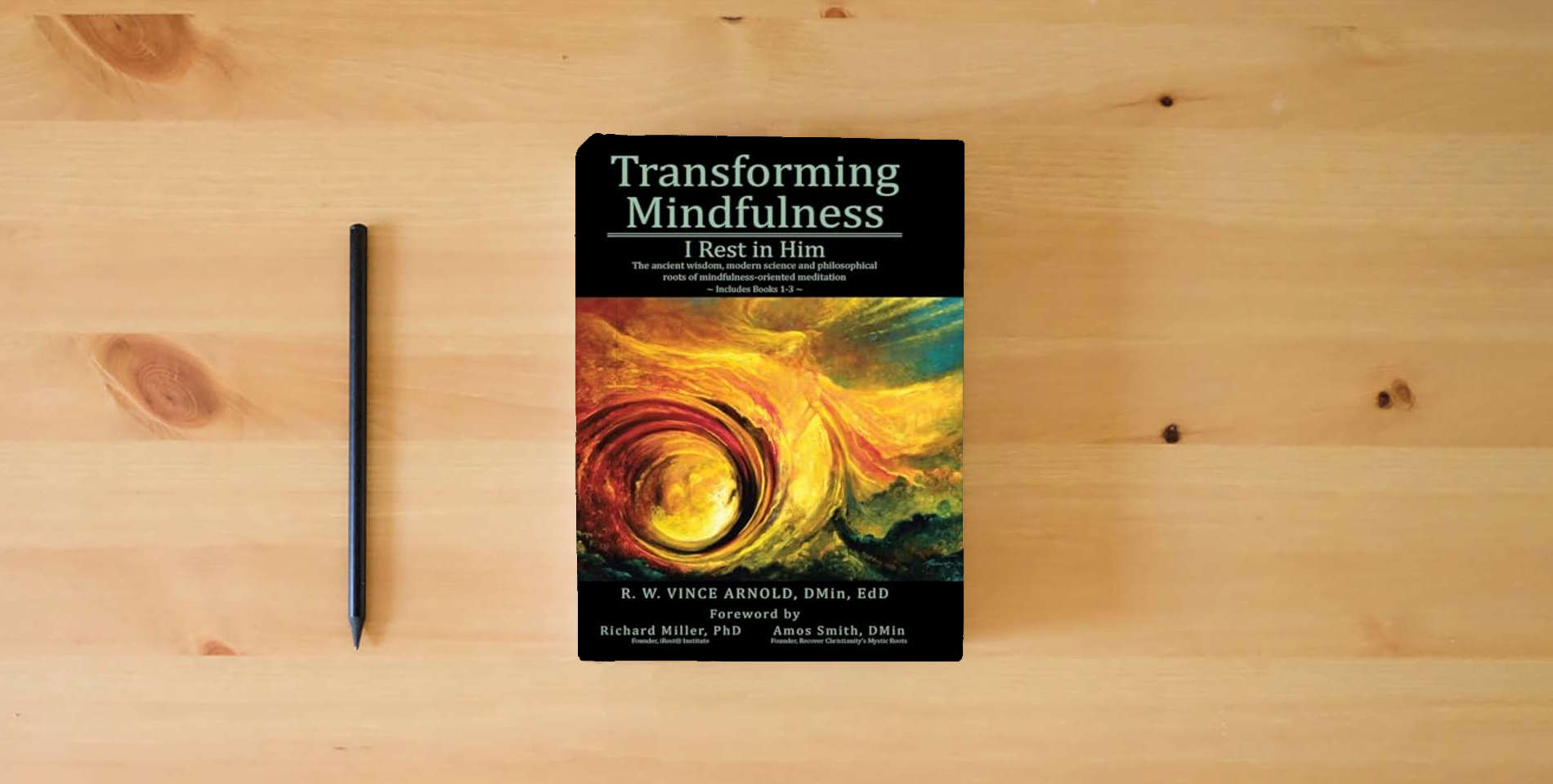 The book Transforming Mindfulness I Rest in Him: The ancient wisdom, modern science and philosophical roots of mindfulness-oriented meditation is on the table