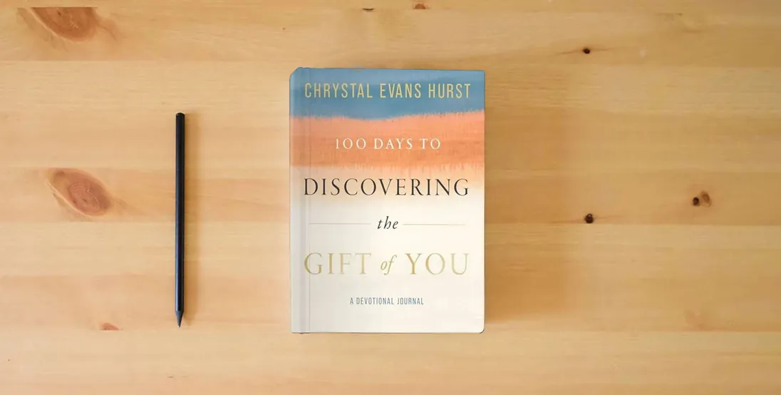 The book 100 Days to Discovering the Gift of You: A Devotional Journal} is on the table