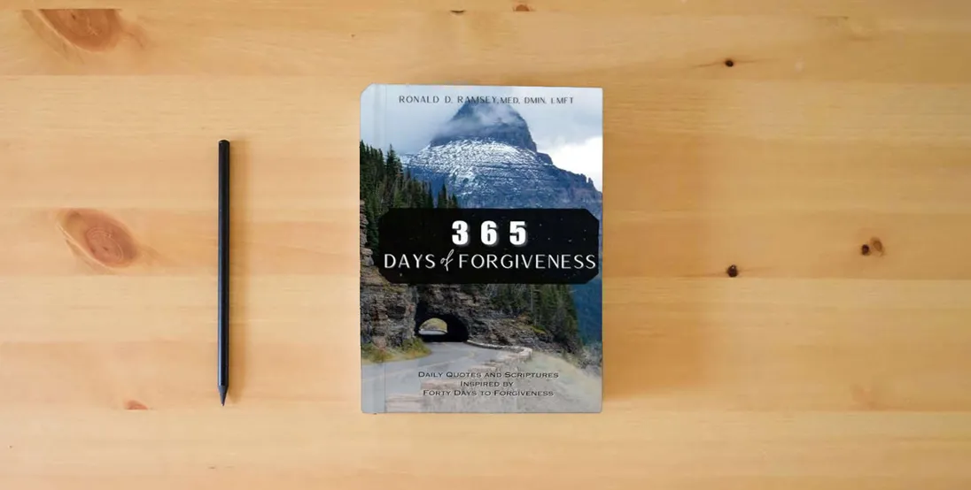 The book 365 Days of Forgiveness: Daily Quotes and Scriptures Inspired by “Forty Days to Forgiveness”} is on the table