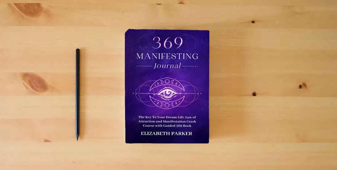 The book 369 Manifesting Journal: The Key to Your Dream Life. Law of Attraction and Manifestation Crash Course with Guided 369 Book} is on the table