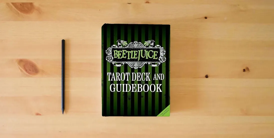 The book Beetlejuice Tarot Deck and Guide (Tarot/Oracle Decks)} is on the table