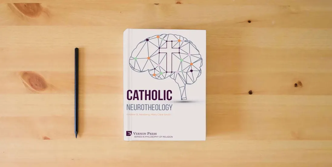 The book Catholic Neurotheology (Philosophy of Religion)} is on the table