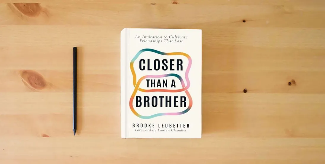 The book Closer Than A Brother: An Invitation to Cultivate Friendships That Last} is on the table