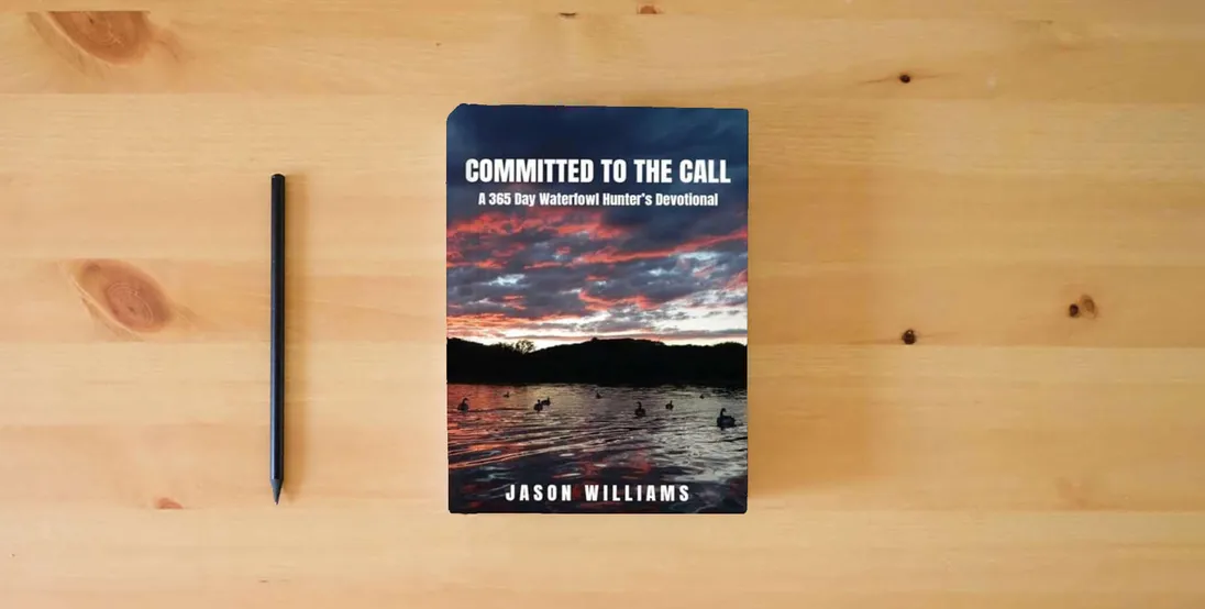 The book Committed to the Call: A 365 Day Waterfowl Hunter's Devotional} is on the table