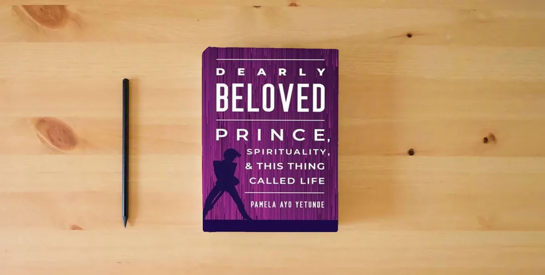 The book Dearly Beloved: Prince, Spirituality, and This Thing Called Life} is on the table