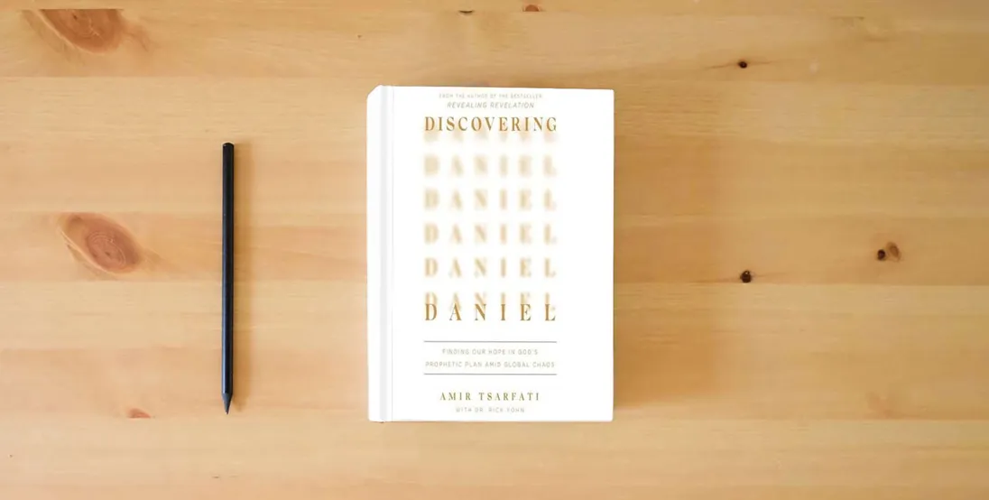 The book Discovering Daniel: Finding Our Hope in God's Prophetic Plan Amid Global Chaos} is on the table