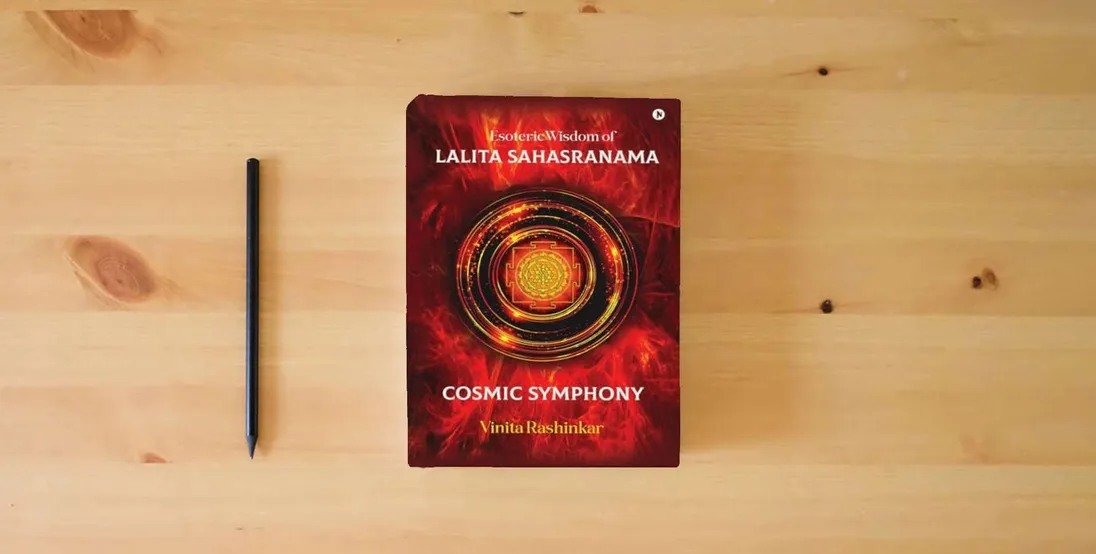 The book Esoteric Wisdom of Lalita Sahasranama - Cosmic Symphony} is on the table