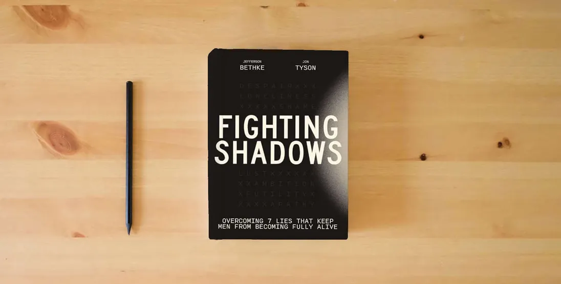 The book Fighting Shadows: Overcoming 7 Lies That Keep Men From Becoming Fully Alive} is on the table