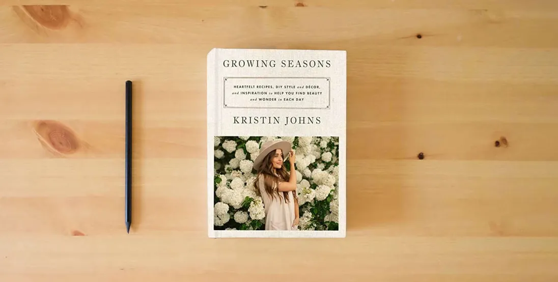 The book Growing Seasons: Heartfelt Recipes, DIY Style and Décor, and Inspiration to Help You Find Beauty and Wonder in Each Day} is on the table