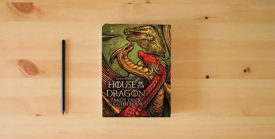 The book House of the Dragon Tarot Deck and Guidebook} is on the table