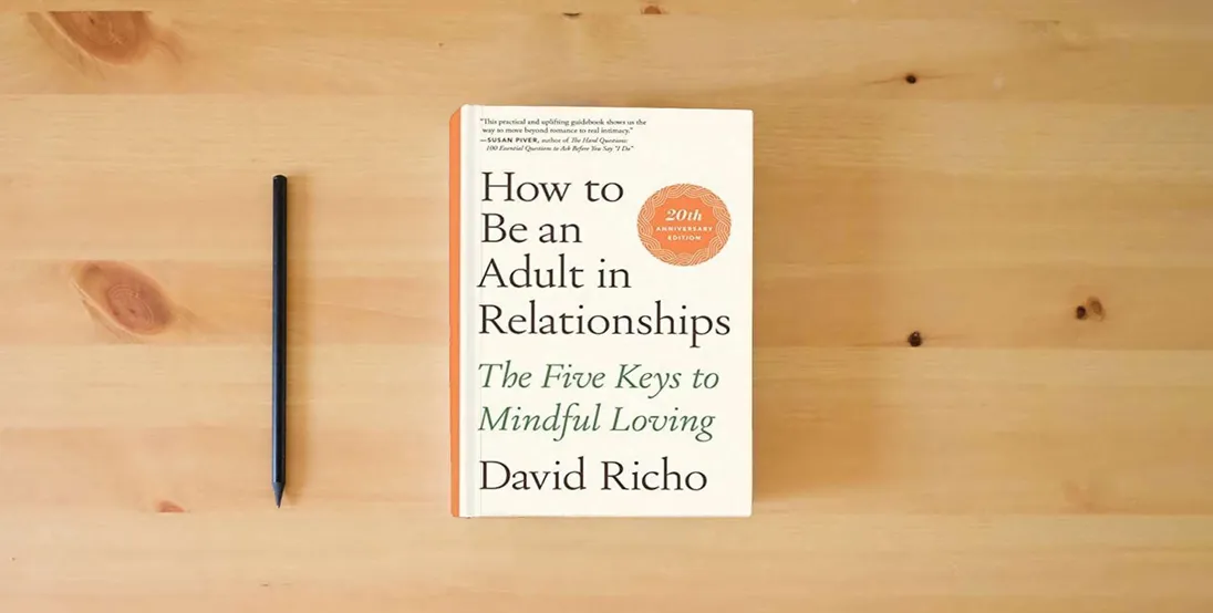 The book How to Be an Adult in Relationships: The Five Keys to Mindful Loving} is on the table