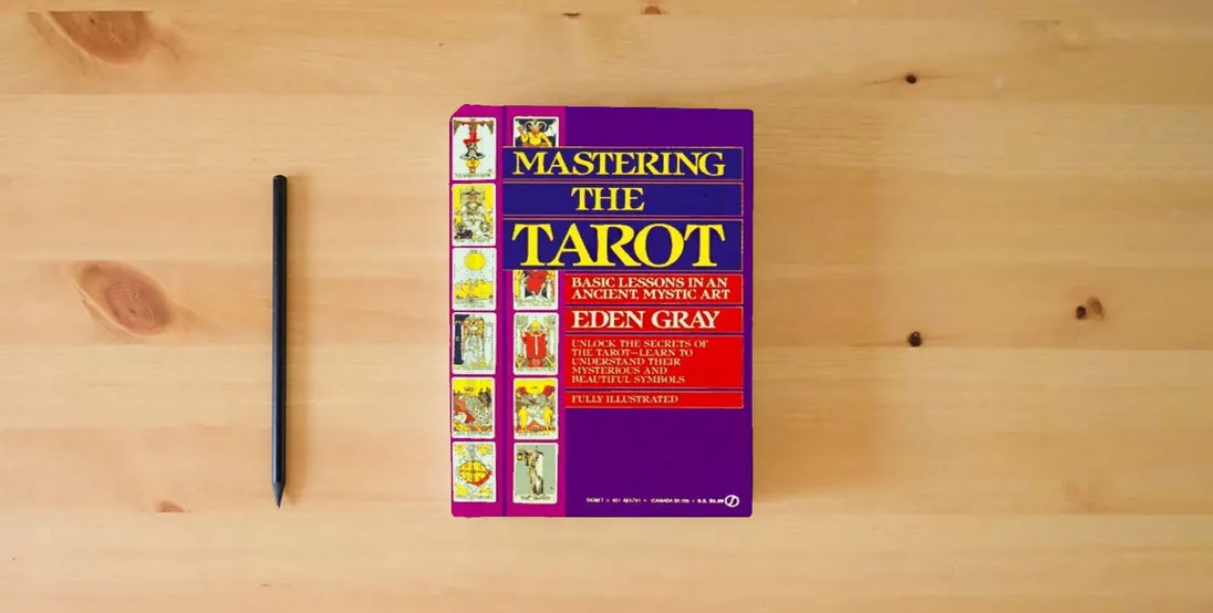 The book Mastering the Tarot: Basic Lessons in an Ancient Mystic Art} is on the table