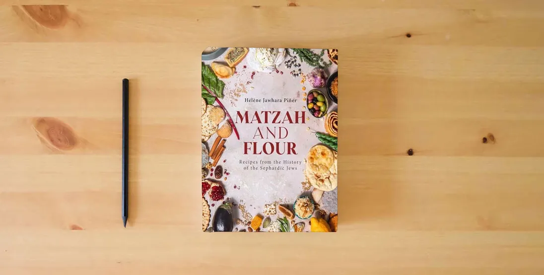 The book Matzah and Flour: Recipes from the History of the Sephardic Jews} is on the table