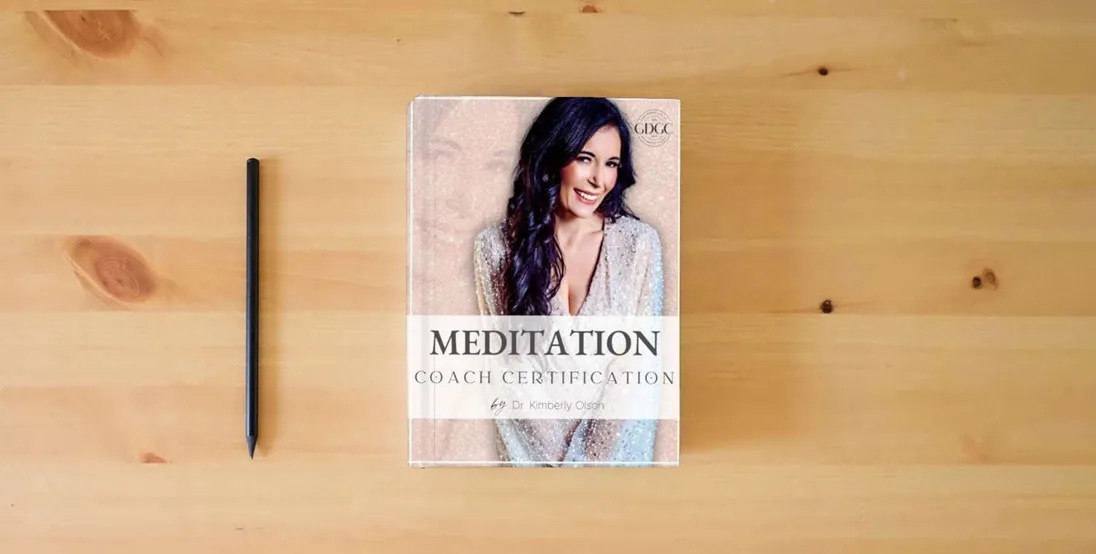 The book Meditation Coach} is on the table