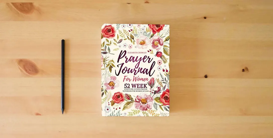 The book Prayer Journal For Women: 52 Week Scripture, Guided Prayer Notebook For Women Of God} is on the table
