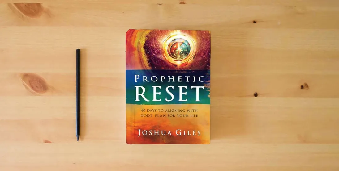 The book Prophetic Reset: 40 Days to Aligning with God's Plan for Your Life} is on the table