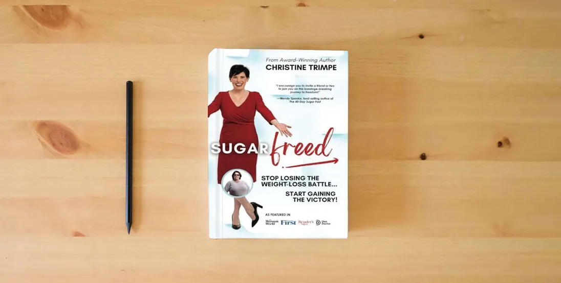 The book SugarFreed: Stop Losing the Weight Loss Battle, Start Gaining the Victory} is on the table