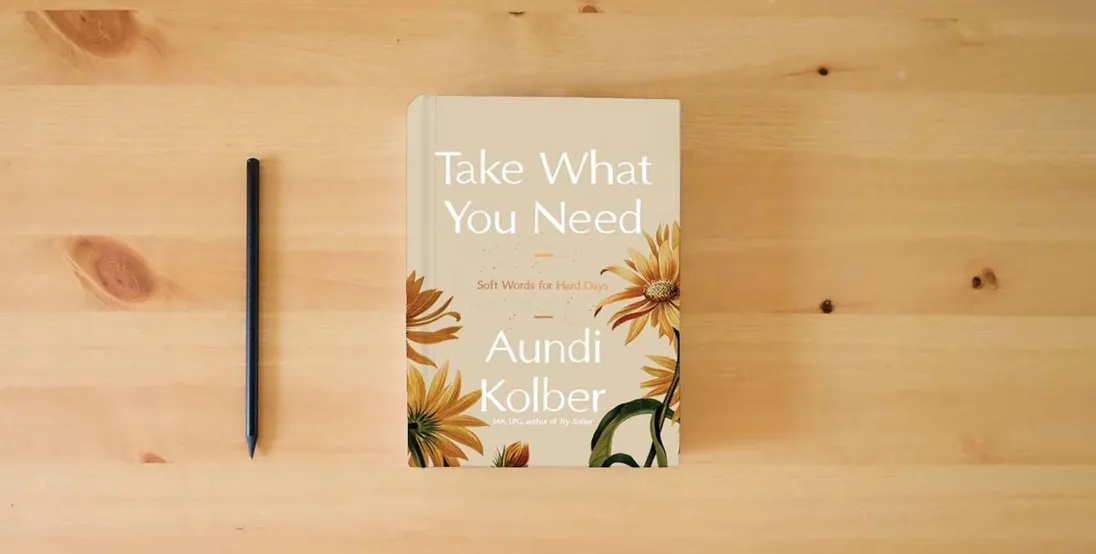 The book Take What You Need: Soft Words for Hard Days} is on the table