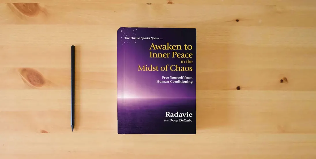 The book The Divine Sparks Speak ... Awaken to Inner Peace in the Midst of Chaos: Free Yourself from Human Conditioning} is on the table