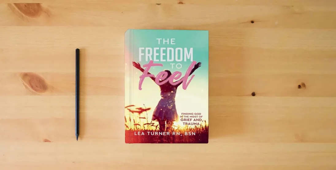 The book The Freedom To Feel: Finding God in the Midst of Grief and Trauma} is on the table