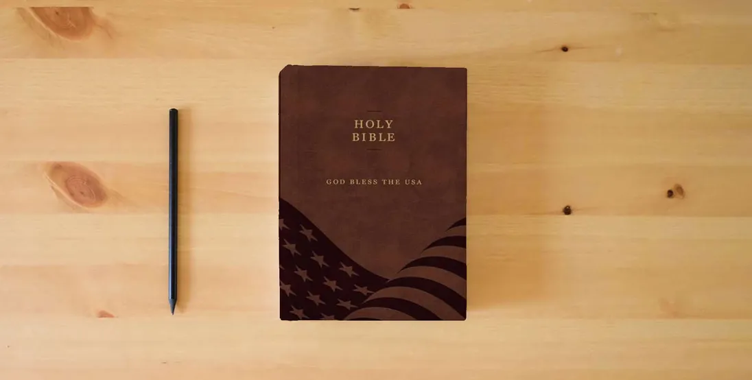 The book The God Bless The USA Bible: A Patriotic American Bible} is on the table