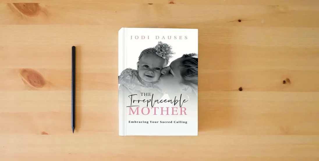 The book The Irreplaceable Mother: Embracing Your Sacred Calling} is on the table