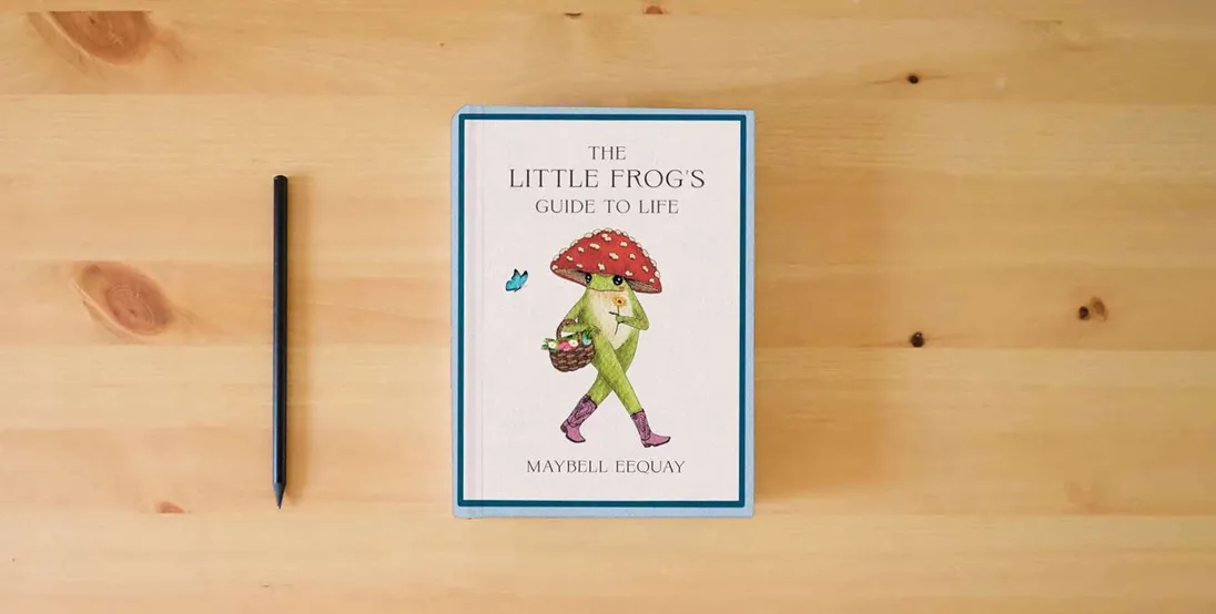 The book The Little Frog's Guide to Life: Love, Advice and Inspiration for Every Day from the Internet’s Beloved Mushroom Frog} is on the table