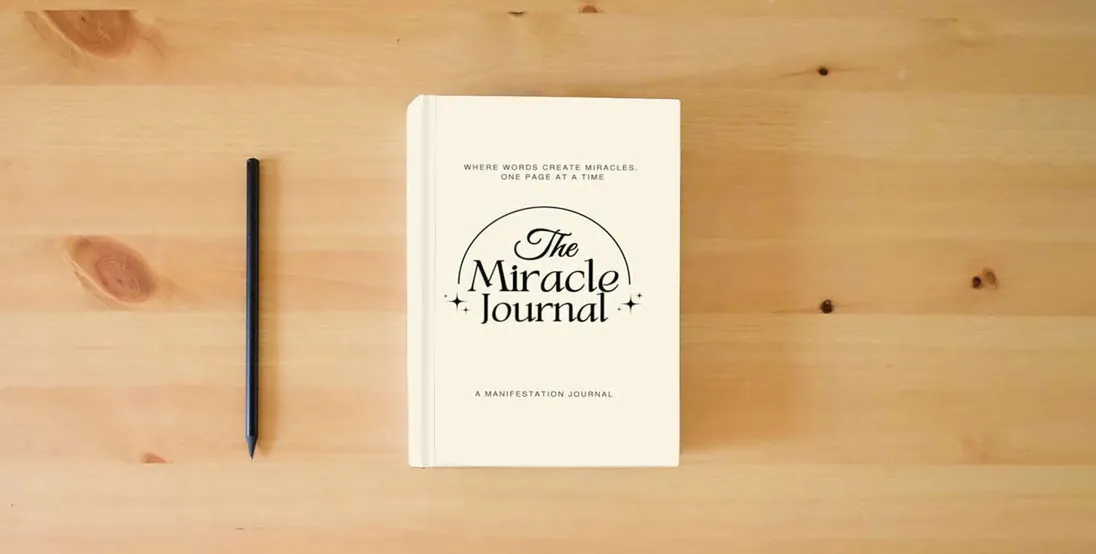 The book The Miracle Journal: Your Guided Manifestation & Gratitude Journal} is on the table