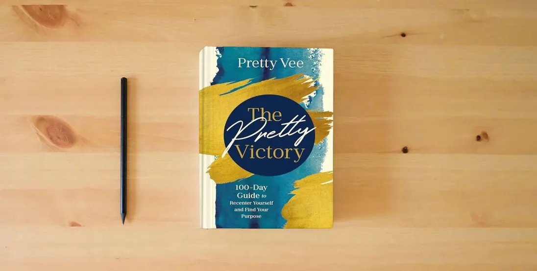 The book The Pretty Victory: 100-Day Guide to Recenter Yourself and Find Your Purpose} is on the table