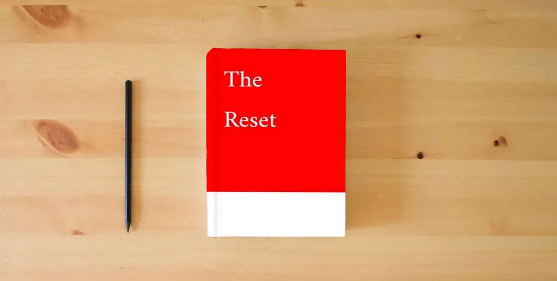 The book The Reset} is on the table