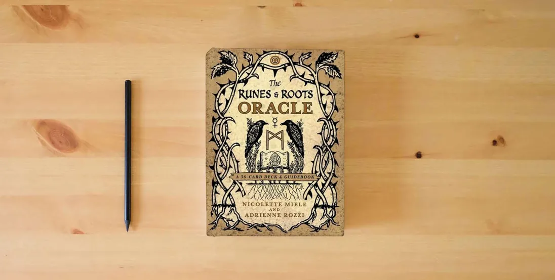 The book The Runes and Roots Oracle: A 36-Card Deck and Guidebook} is on the table