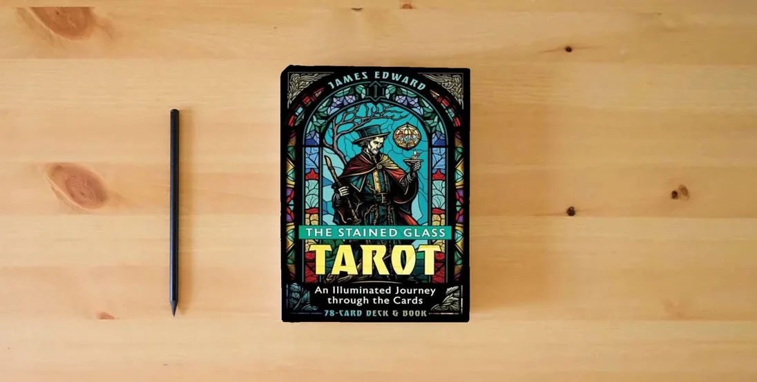 The book The Stained Glass Tarot: An Illuminated Journey through the Cards} is on the table