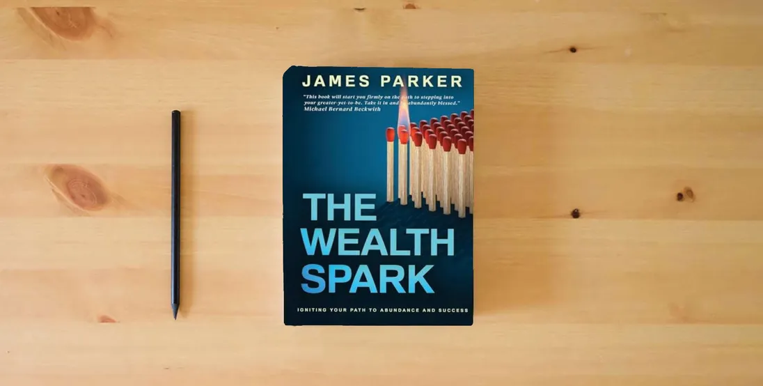 The book The Wealth Spark: Igniting Your Path to Abundance and Success} is on the table